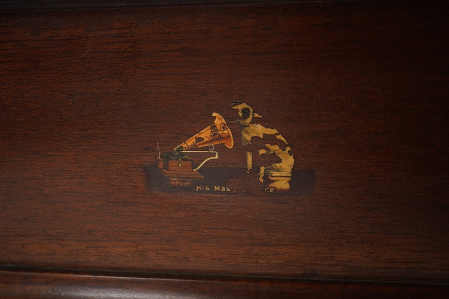 An HMV tabletop mahogany gramophone player with large laminated wooden horn, diameter of horn 55cm. HMV transfer labels to both body and horn. Condition - fair.